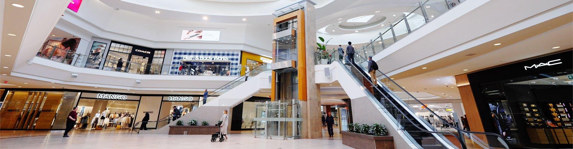 Modern shopping centre interior with retail stores highlighting leasing opportunities
