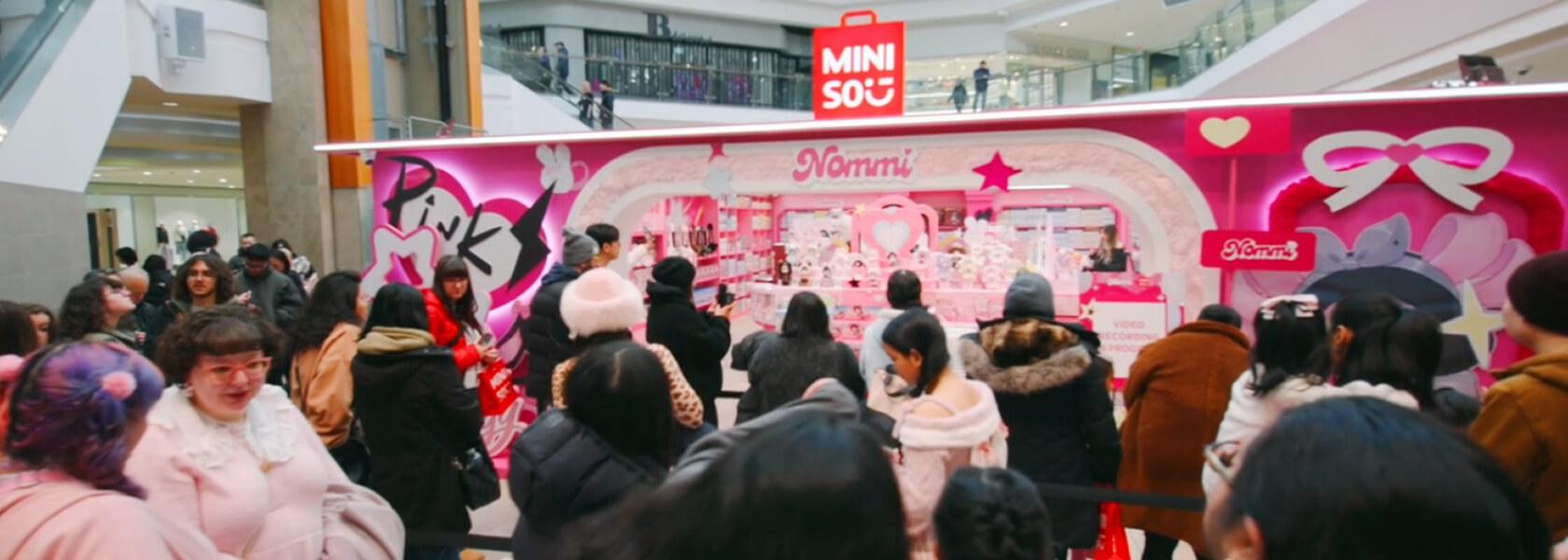 Retail activation near Miniso attracting crowds and highlighting specialty leasing opportunities