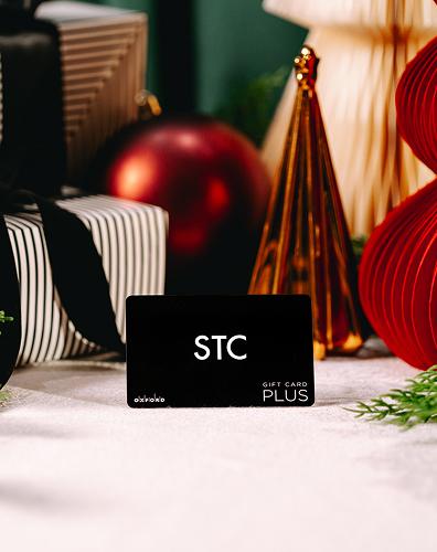 Holiday gift card with festive decor highlighting flexible gifting options available at the centre