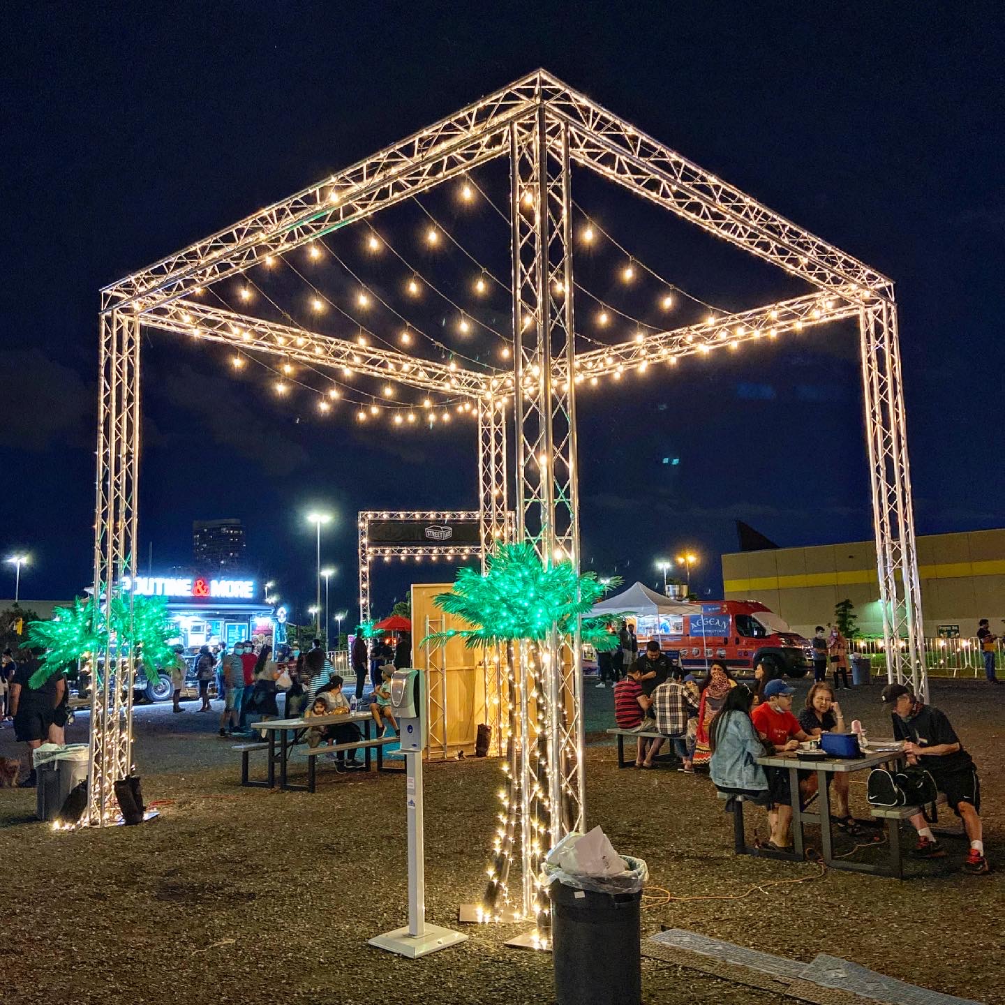 Gazebo covered in lights at a night festival