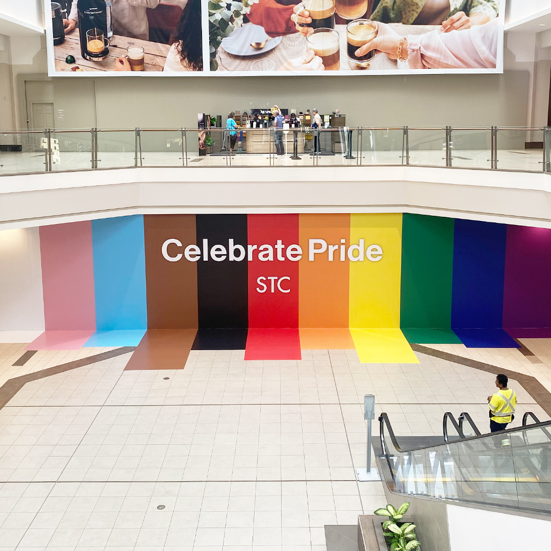Celebrate Pride written on a striped wall
