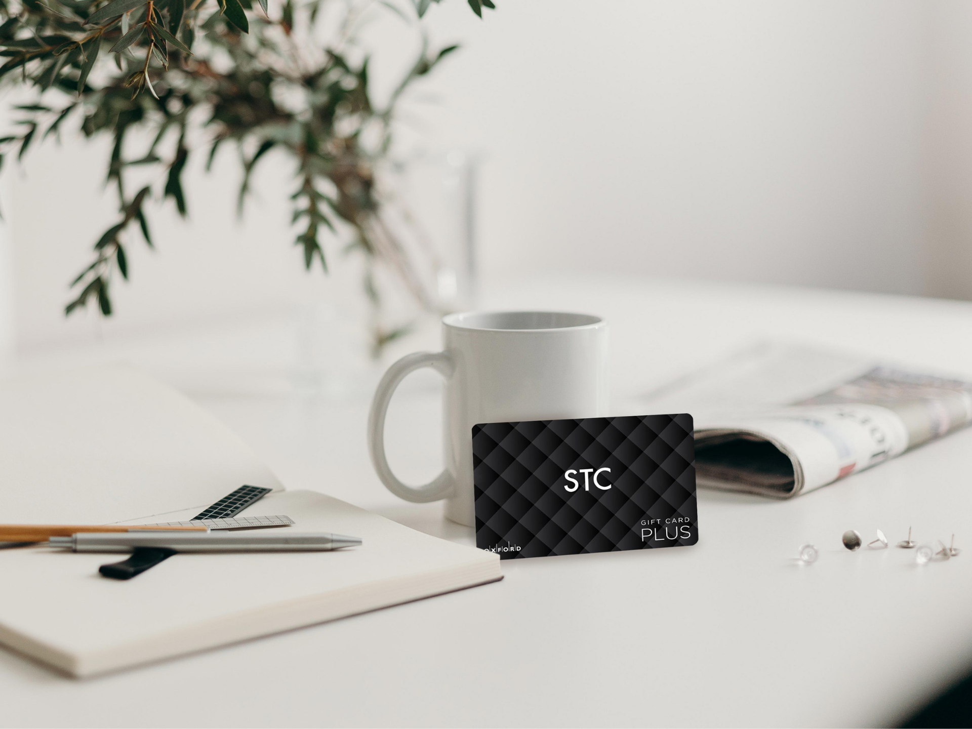 STC gift card and white mug