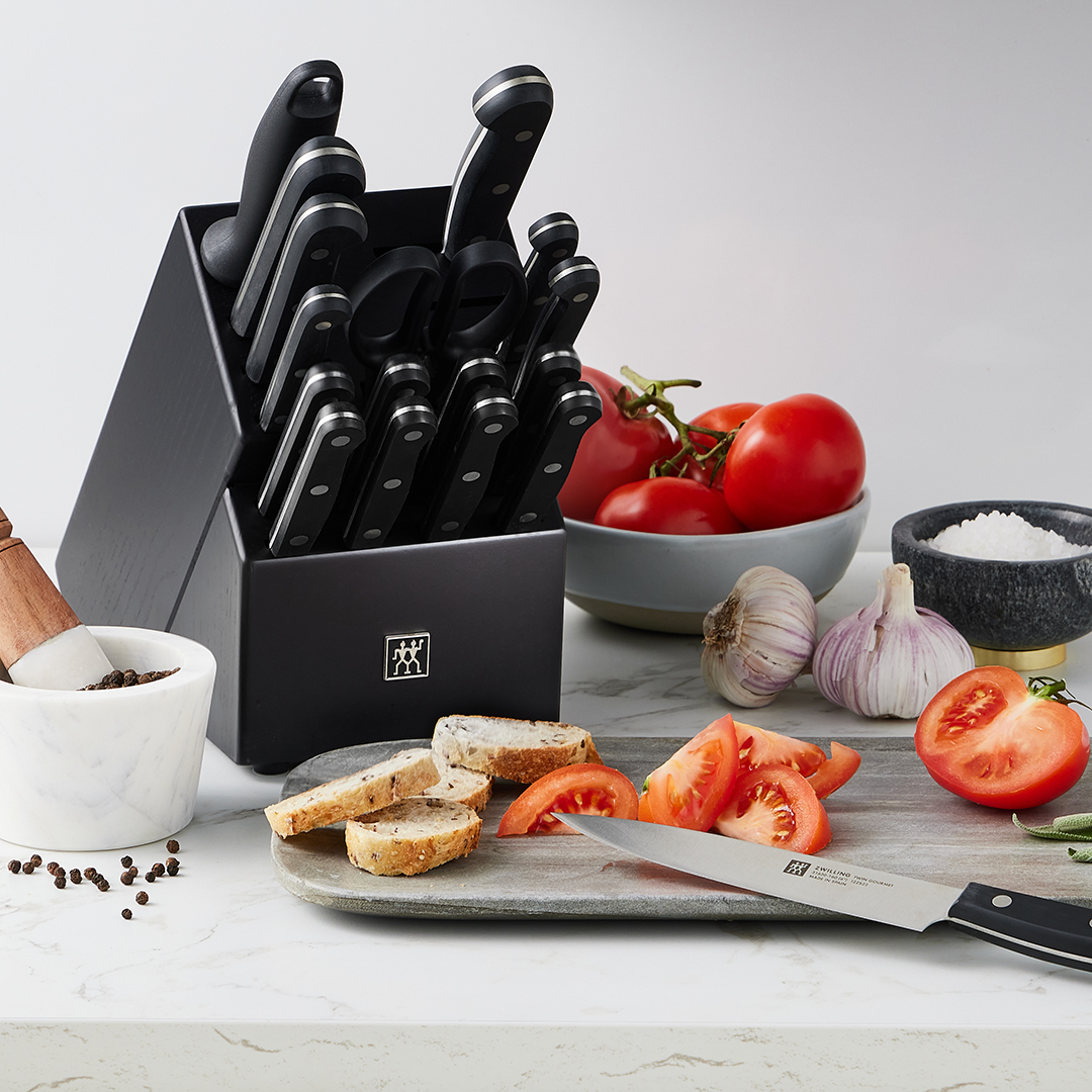 image of black knife block with knives in the kitchen
