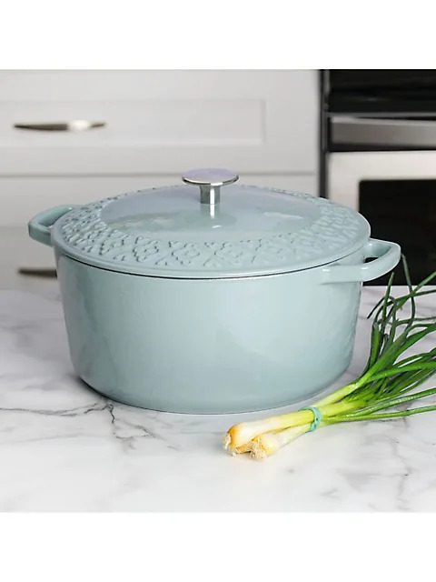 Blue dutch oven on a marble countertop