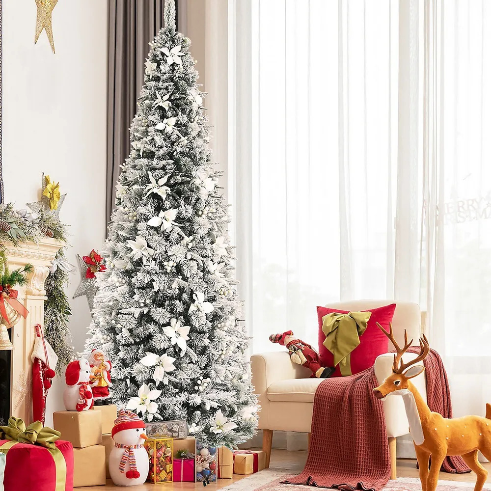 A festively adorned Christmas tree stands in a cozy living room, adorned with beautiful decorations.