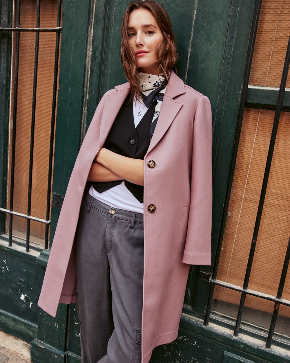 woman modelling a mauve trenchcoat