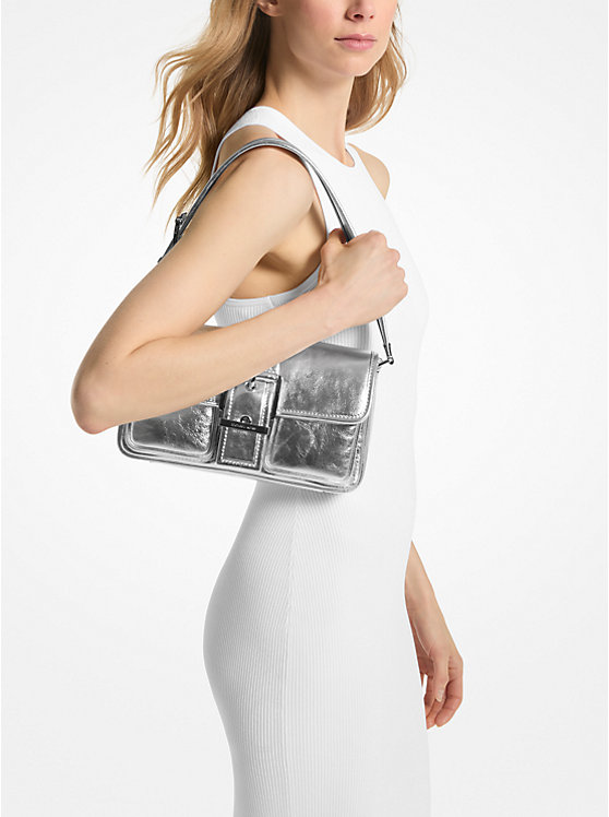 woman modelling a metallic purse