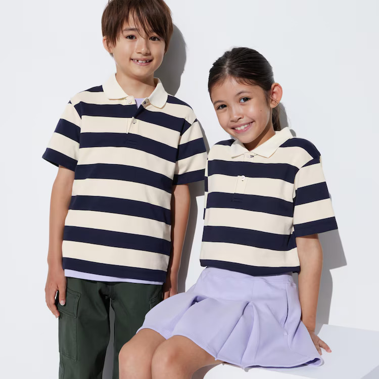boy and girl modelling in striped polo shirts