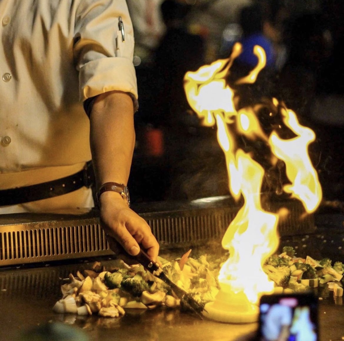 chef cooking teppanyaki style