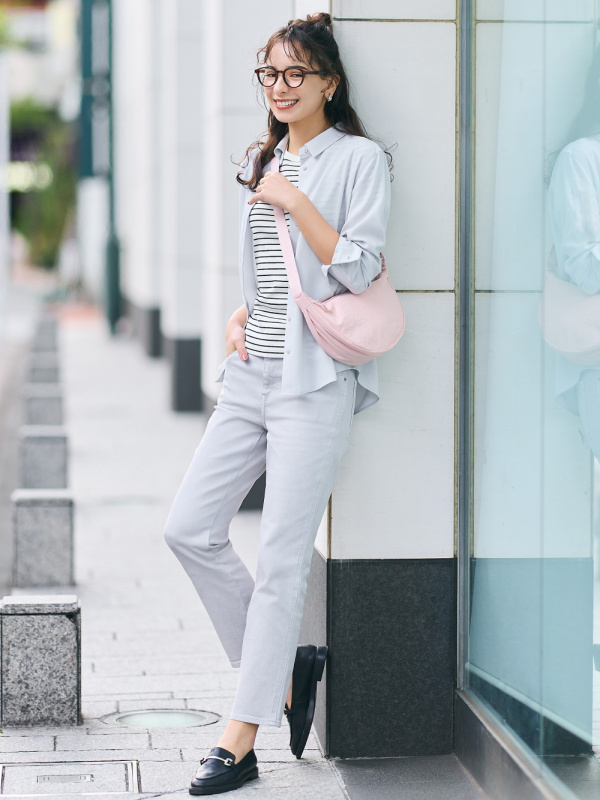 women modelling in casual wear with pink crossbody bag outdoors