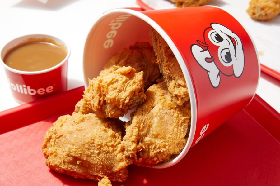 a bucket of fried chicken on tray