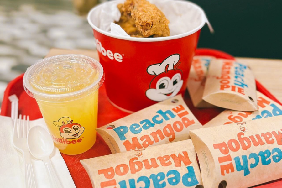 jollibee chicken, peach mango pie, and pineapple drink on tray