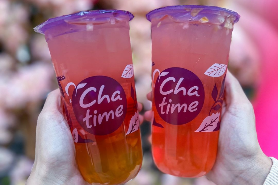 2 chatime drinks being held