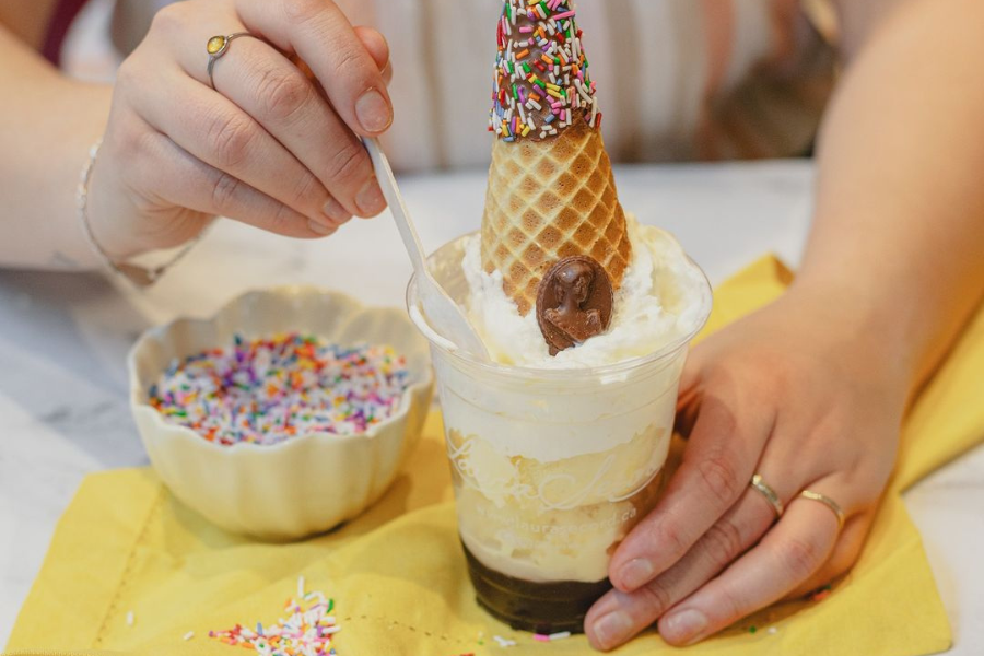 a person eating an ice cream sundae