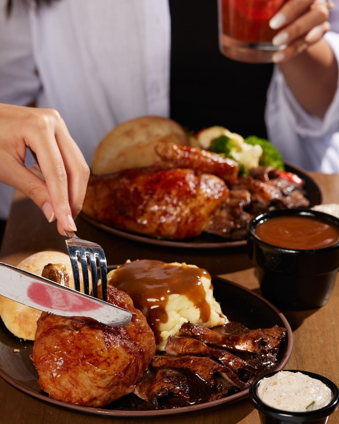 two people eating turkey dinner