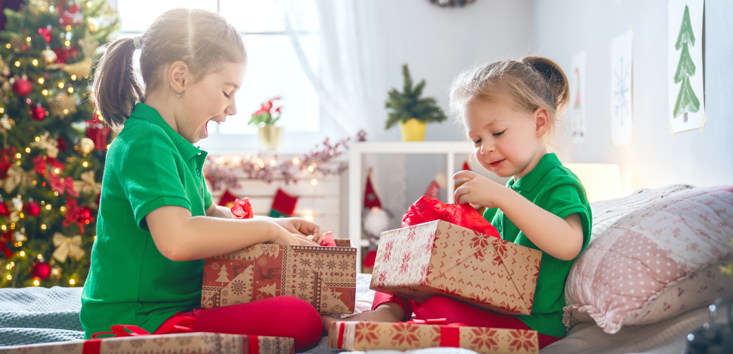 2 girls opening presents