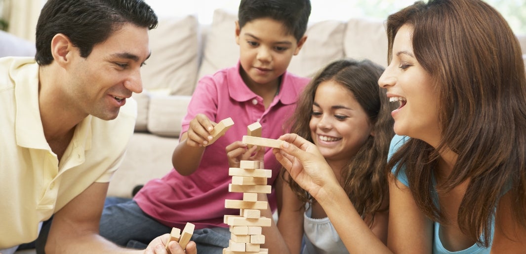a family playing jenga