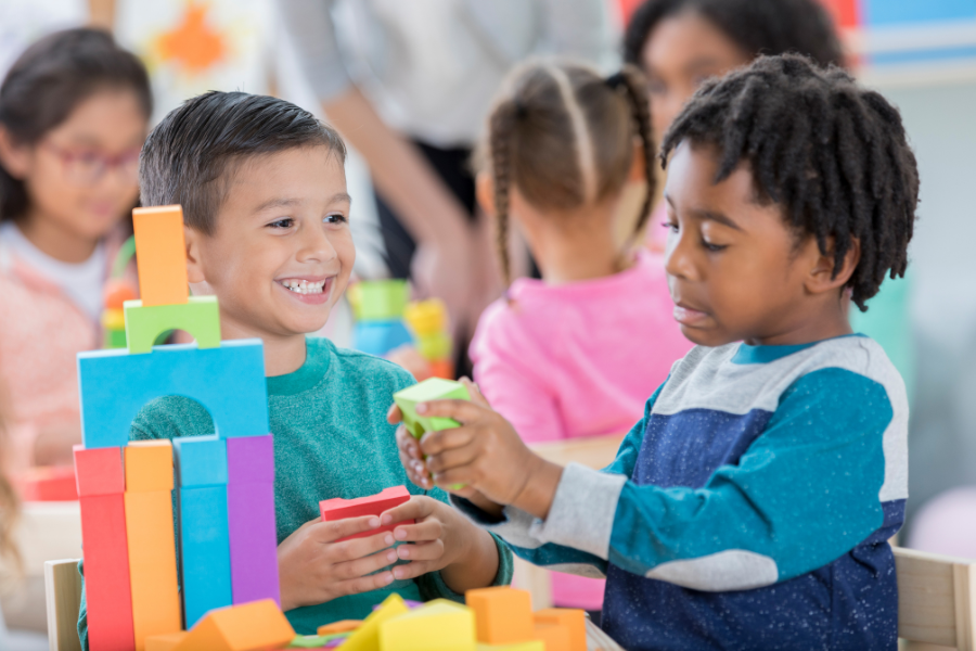 kindergarten children playing with blocks