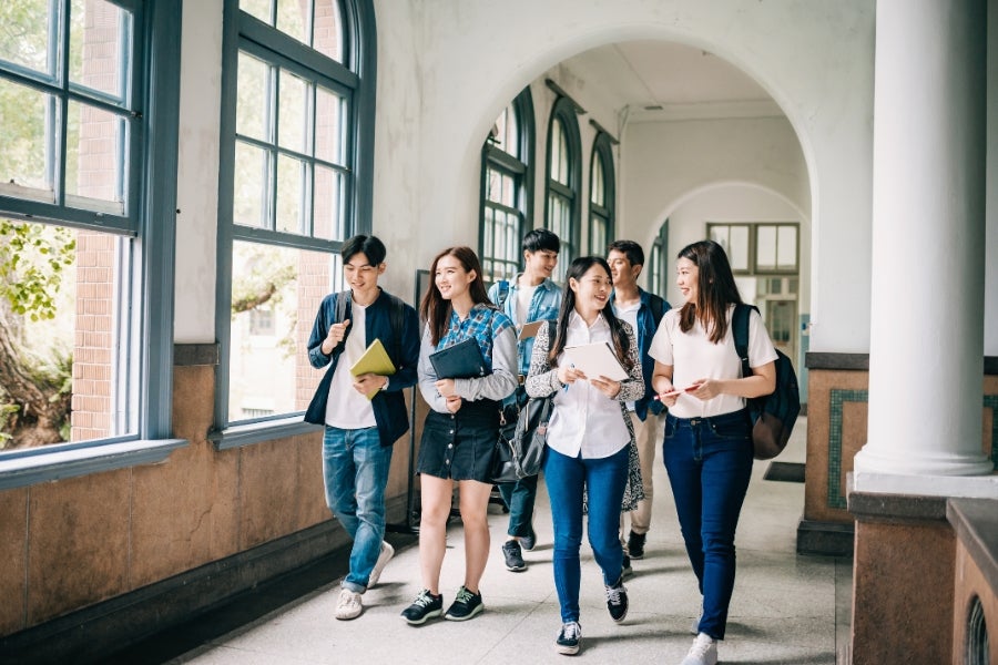 university students walking on campus