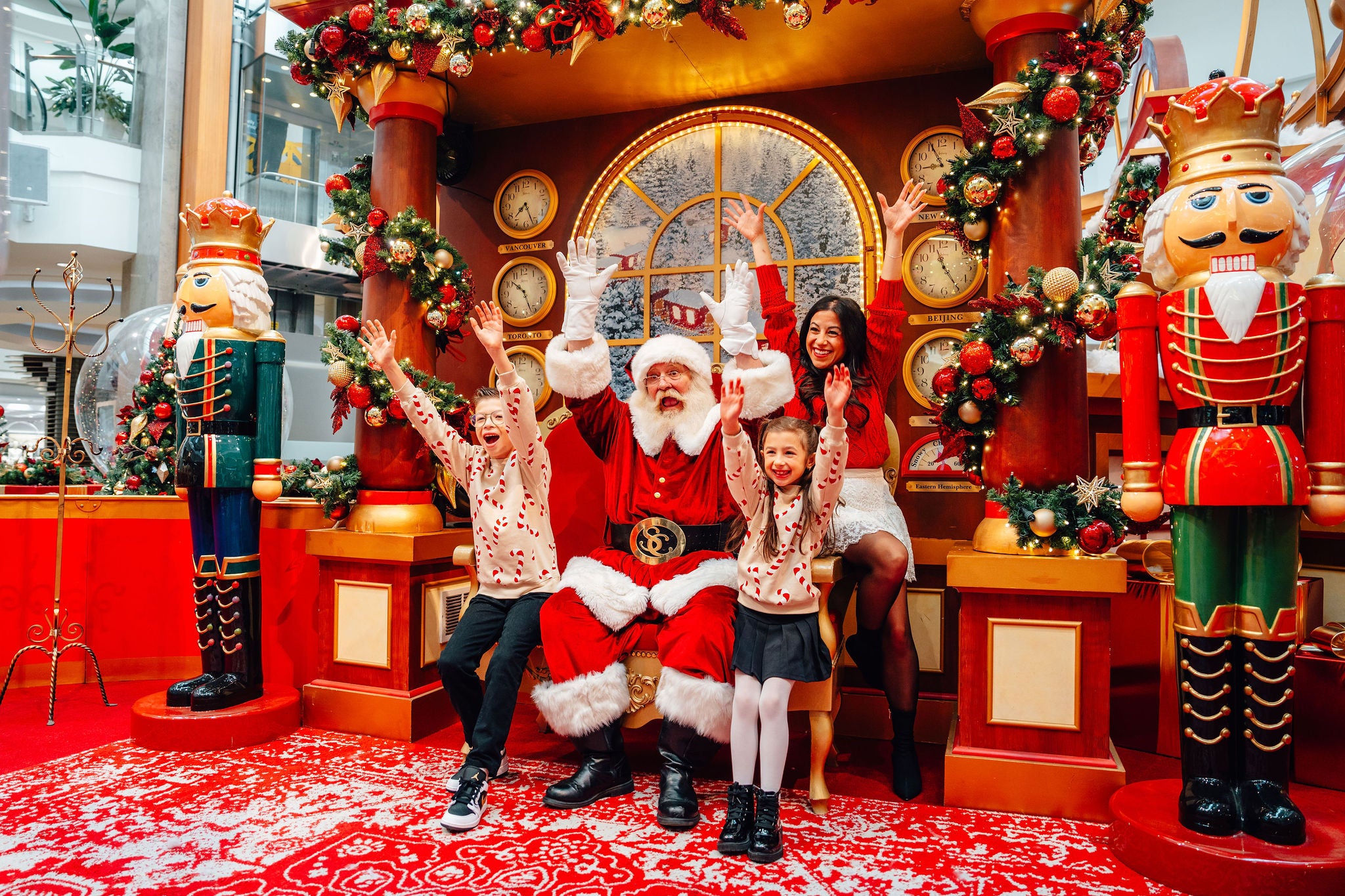 family taking picture with santa