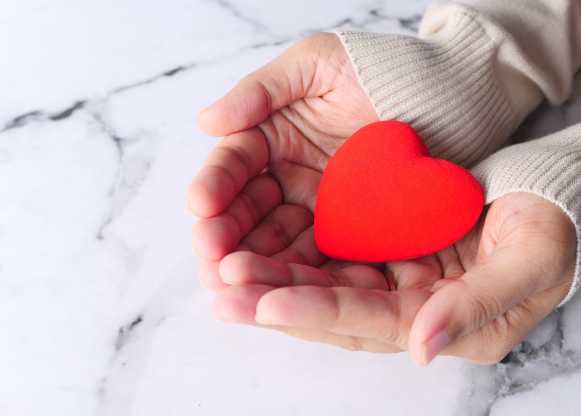 someone holidng a heart