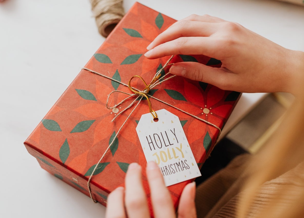 a person opening a gift